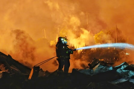 Firefighters work to extinguish a fire