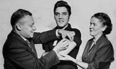 Elvis Presley receives a polio vaccination from doctors at the CBS studios, New York, in 1956. 