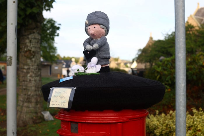 A knitted figure depicting the Queen near Balmoral