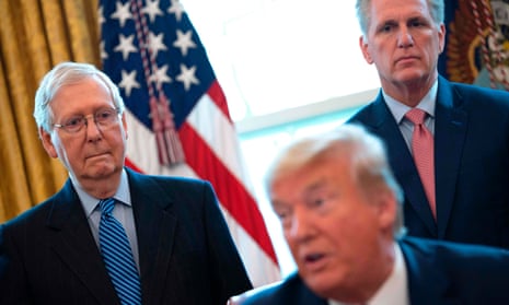 Mitch McConnell and Kevin McCarthy look on.