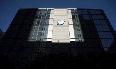 A Twitter logo hangs outside the company's San Francisco offices on