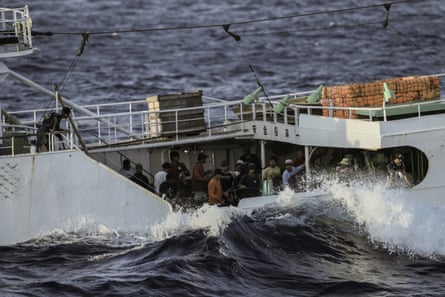 A crew bring in their lines in the mid-Atlantic ocean.