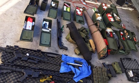 This undated photo released by the Long Beach police department shows weapons and ammunition seized from a cook at a Los Angeles-area hotel who allegedly threatened a mass shooting.