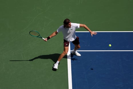 Stefanos Tsitsipas returns against Arthur Fils.