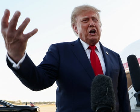 Donald Trump speaks to the press as he arrives at Charlotte Douglas International Airport on 16 September.