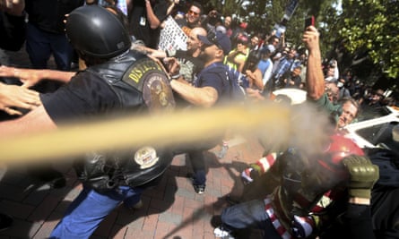 Pepper spray is used as anti- and pro-Donald Trump protesters clash.
