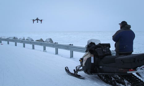 Dennis Davis flies his drone by the edge of Shishmaref.