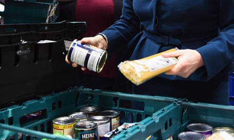 a woman looks at options at a food bank