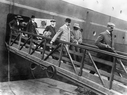 Dr Crippen being escorted from the liner Montrose by Inspector Walter Dew, after being arrested at sea.