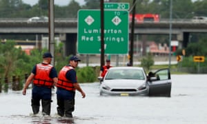 Members of the coast guard help a stranded motorist in the flood waters caused by Hurricane Florence in Lumberton, North Carolina.