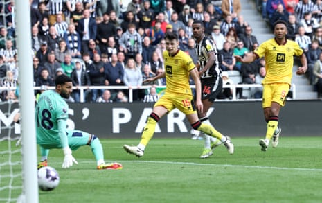 Alexander Isak looks on as he scores his team's first goal past Wes Foderingham