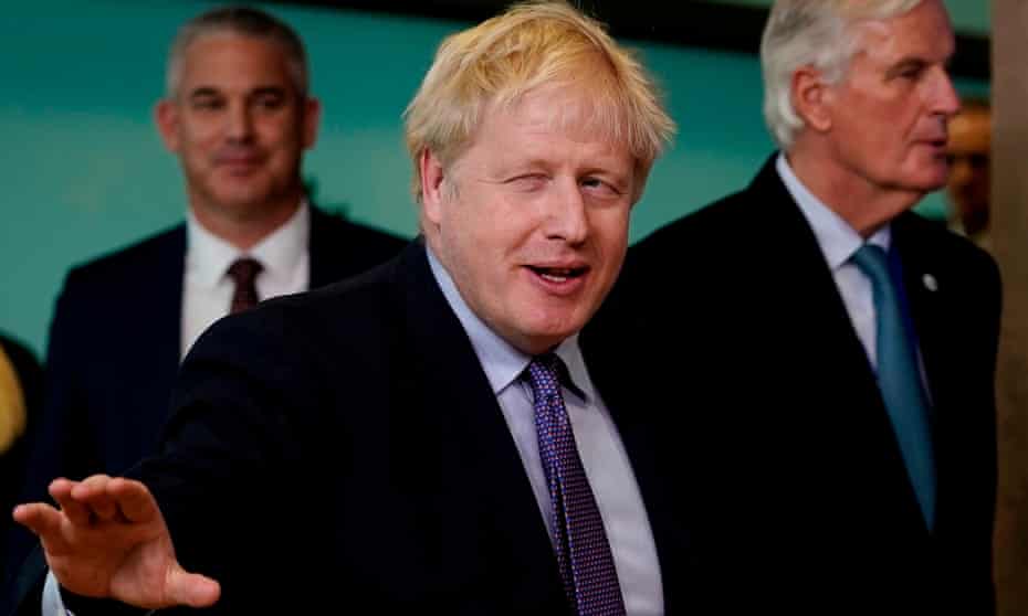 Boris Johnson, centre, with the EU’s chief Brexit negotiator Michel Barnier.