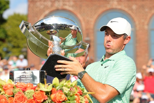 Rory McIlroy celebrates with the FedEx Cup after his victory on Sunday