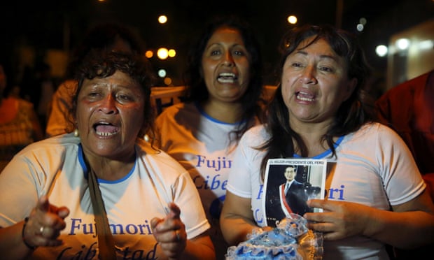 Alberto Fujimori supporters celebrate outside Centenario hospital in Lima on 24 December.