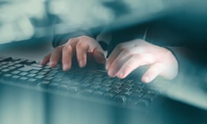 Person typing at a keyboard