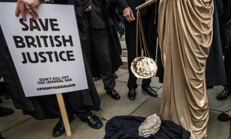Lawyers staging a walkout, London this June, over legal aid cuts