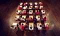 Teenagers using mobile phones while seated in rows during an exam.