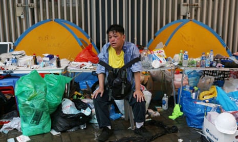 A protester rests during the demonstration against the proposed extradition bill