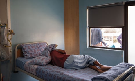 A TB patient sleeps in his room inside Ward 16 at the Sizwe Tropical Diseases Hospital in Johannesburg, South Africa.