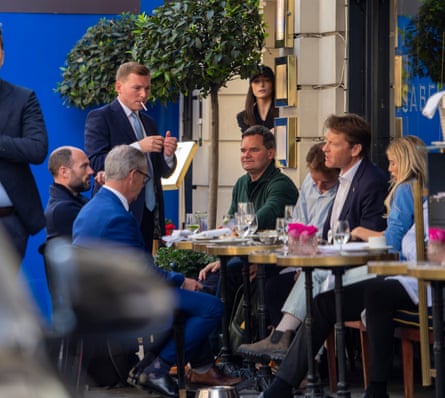 Pictured around an outdoor restaurant table in May 2023 from left: Nigel Farage, Chris Bruni-Lowe, George Cottrell, Neil Gallacher of gambling group Mansion Group, Philip van Scheltinga, Richard Tice, and Cottrell’s then girlfriend Georgia Toffolo.