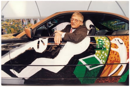 Lighting up … Hockney stops for a puff.