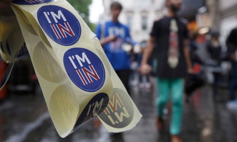 A supporter of the Remain campaign with stickers saying “I’m in”