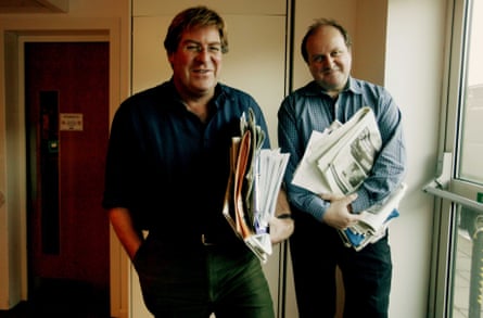 Stourton and Naughtie stood holding copies of print newspapers