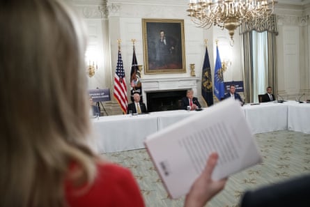 CBS White House correspondent Paula Reid holds a copy of John Bolton’s book as she asks a question of Donald Trump at the White House.