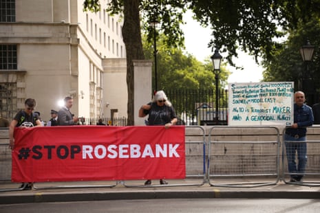 Demonstrators with a sign on Whitehall this morning.