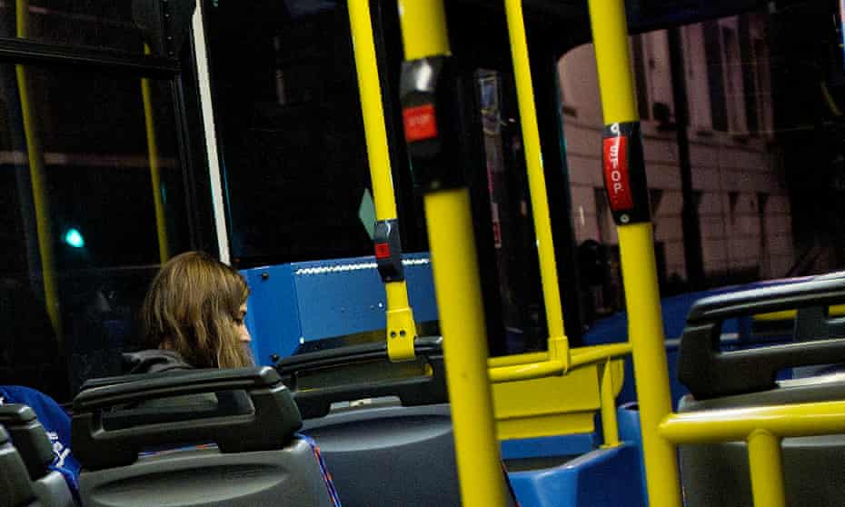 woman sitting alone in bus at night