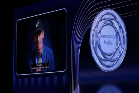 Alex de Minaur is seen on a big screen after beingawarded the Newcombe medal at a ceremony in Melbourne this week.