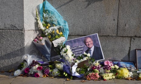 Tributes to Sir David Amess outside parliament in London