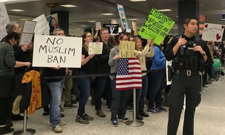 People protest at Washington Dulles airport.