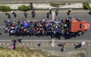 Aerial view of Honduran migrants onboard a truck as they take part in a caravan heading to the US, in the outskirts of Tapachula, on their way to Huixtla, Chiapas state, Mexico, on October 22, 2018.