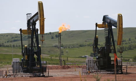 Oil pumps and natural gas burn off in Watford City in North Dakota as the US is currently the world’s largest oil and gas producer.