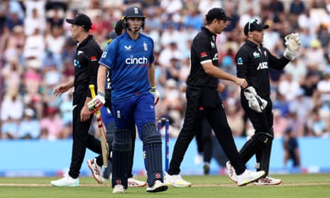 Harry Brook of England leaves the field after being caught out by Trent Boult of New Zealand.