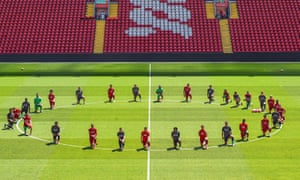 Liverpool players take a knee in memory of George Floyd at training on Monday.