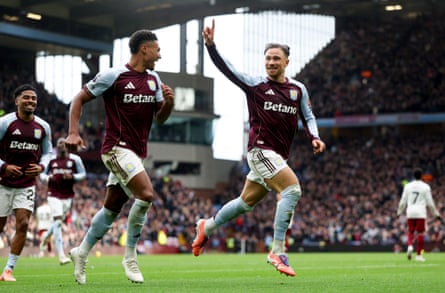 Matty Cash points to the sky after scoring in Aston Villa’s win against Arsenal