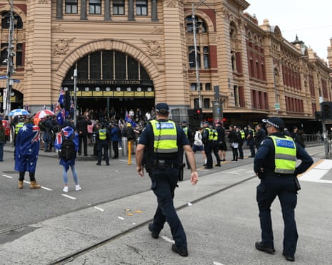 Police and protesters at Flinder St station during Put Australia First rally
