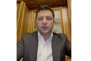 The Ukrainian president, Volodymyr Zelenskiy, addresses the nation in Kyiv. He declared martial law, saying Russia has targeted Ukraine’s military infrastructure and urged Ukrainians to stay home and not panic
