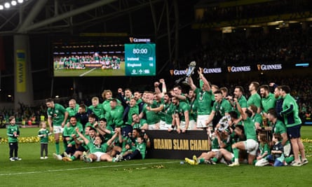 Ireland players celebrate with the Six Nations trophy and Triple Crown trophy after their victory over England gave them their first Six Nations title since 2018 and their fourth Grand Slam.
