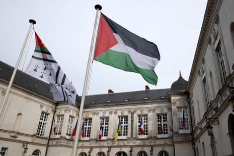 The Palestinian flag flies next to the flag of the city of Nantes in front of the town hall in Nantes, France, the day the French President is due to officially announce France's recognition of the Palestinian state at the UN General Assembly, September 22, 2025.
