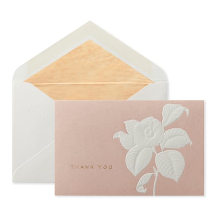 Smythson Camelia Thank You Note card and envelope. The card is blush pink with an embossed white flower.