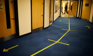 Physical distance markings on the corridor show the Covid-19-compliant measures taken.