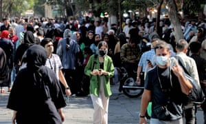 A woman walks with other shoppers at the Grand Bazaar in Iran's capital Tehran on September 28, 2022. Iran's police warned on September 28 that they will confront "with all their might" women-led protests that erupted nearly two weeks ago over the death of Mahsa Amini in custody, despite growing calls for restraint. Widespread protests took place for a 12th straight night the previous evening, according to opposition media based outside Iran, despite internet restrictions designed to impede gatherings and prevent images of the crackdown getting out. Photo by ATTA KENARE / AFP