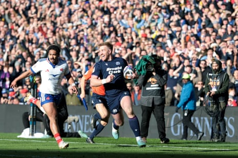 Kyle Steyn of Scotland runs with the ball to go on and scores his team's fifth try.