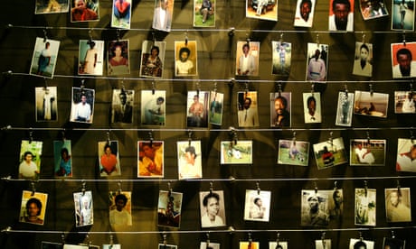 The pictures of dead people donated by survivors are installed on a wall inside the Gisozi memorial in Kigali April 2004.