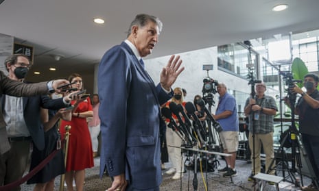 Joe Manchin speaks to reporters on Monday about the agreement he reached with Chuck Schumer.