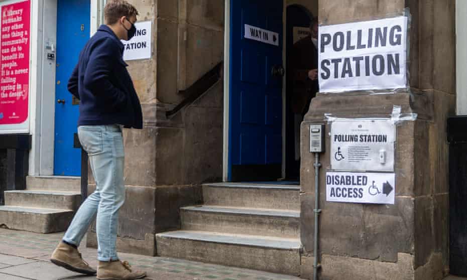 A voter preparing to enter a polling station in London