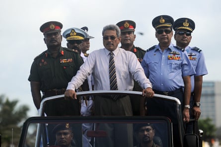 Gotabaya Rajapaksa, then defence minister, centre, rides in a Victory Day parade rehearsal in Colombo in 2013, marking the fourth anniversary of the defeat of the Tamil Tigers.